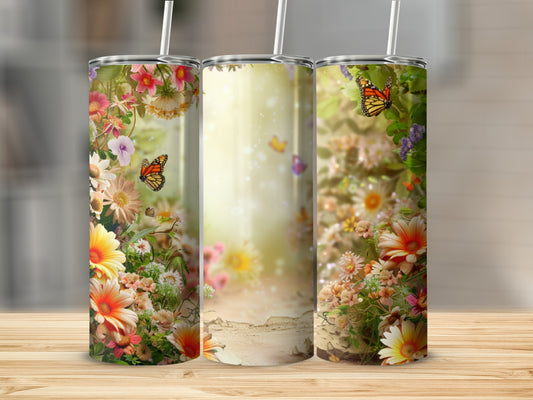 Floral and butterfly tumbler with a light, bokeh background.