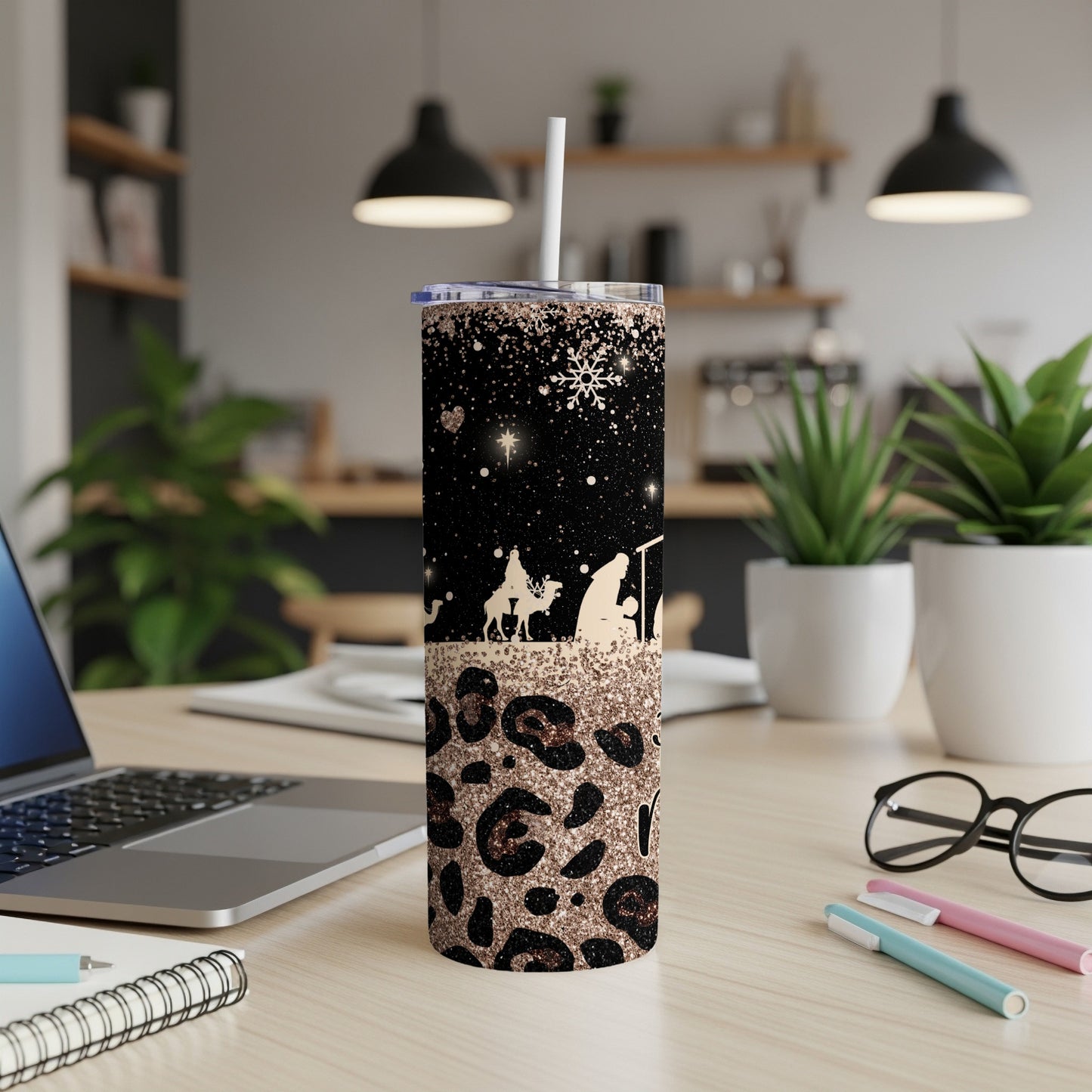 Nativity scene on a leopard print tumbler with scattered stars and snowflakes.