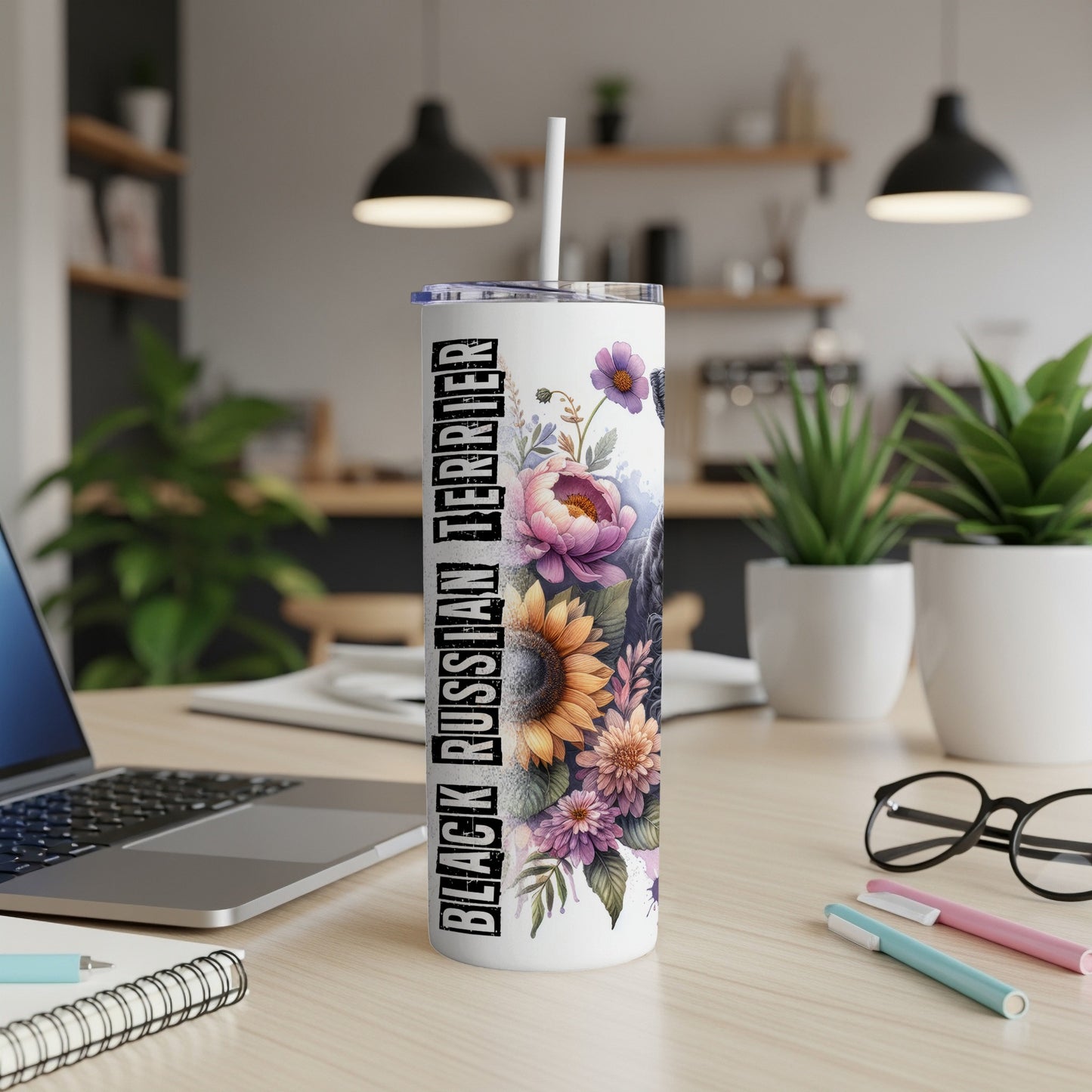 Black Russian Terrier tumbler with floral design and straw.