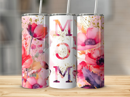 Tumbler with "MOM" text surrounded by vibrant watercolor floral designs.