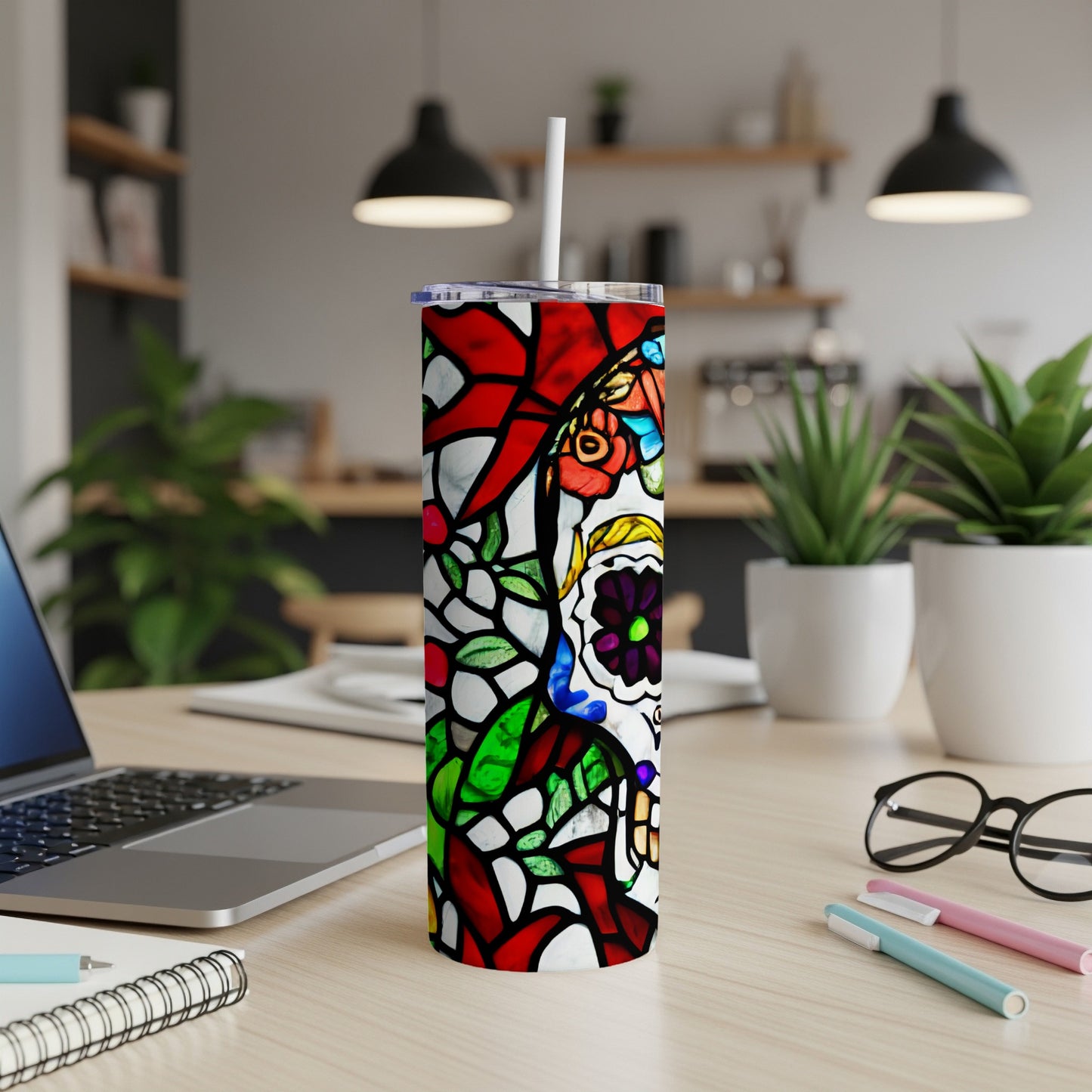 Tall tumbler with stained glass skull and floral design.