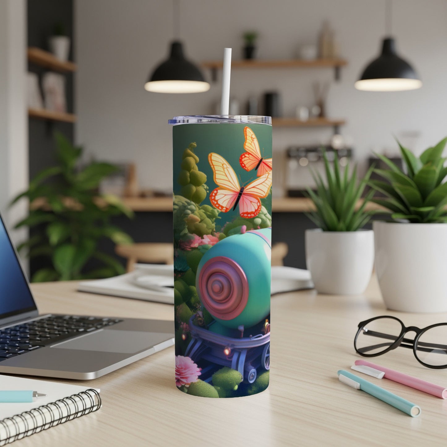 Tumbler with whimsical forest scene, butterflies, and a teal sphere.