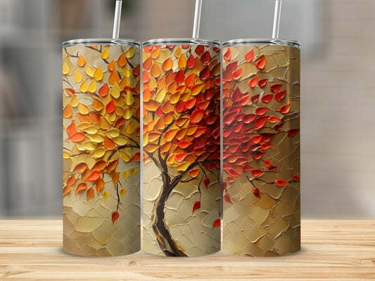 Three tumblers with textured autumn tree art on beige background.