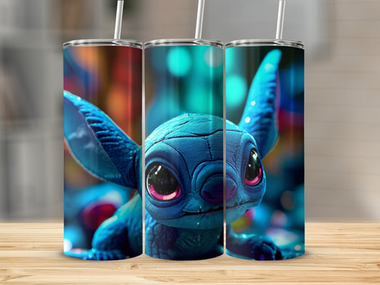 Blue cartoon character with large ears and pink eyes on a tumbler.