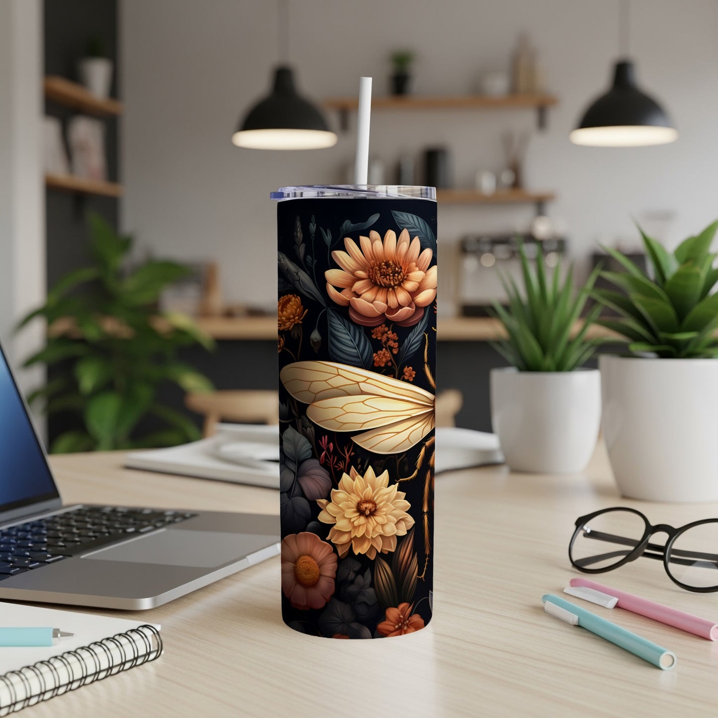 Dark tumbler with dragonfly and floral pattern, white straw.