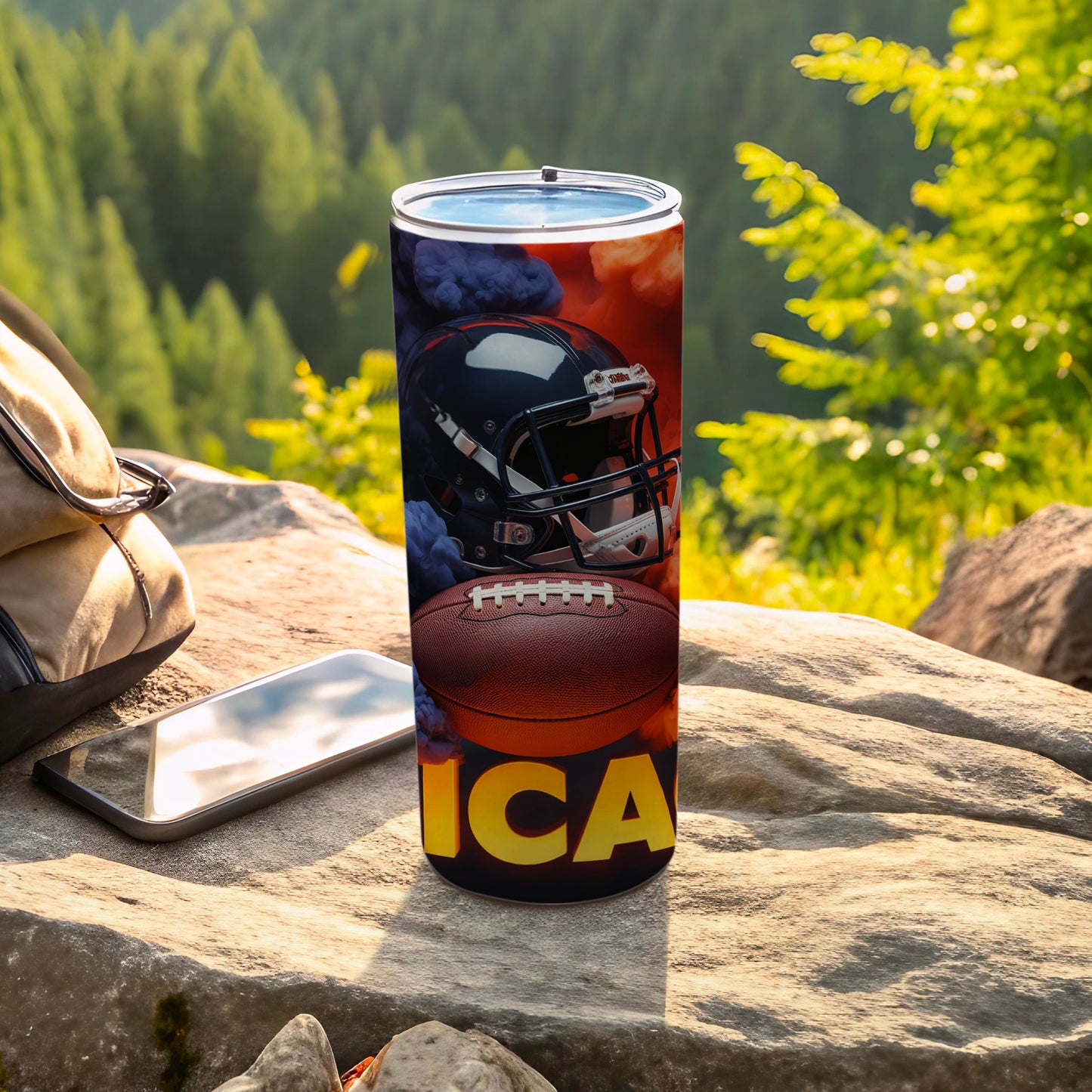 Football helmet and ball on tumbler with "ICA" text.