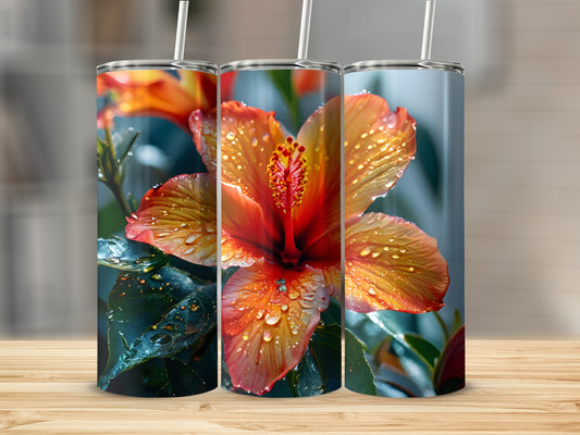 Three tumblers with a close-up of a dew-covered orange hibiscus flower.
