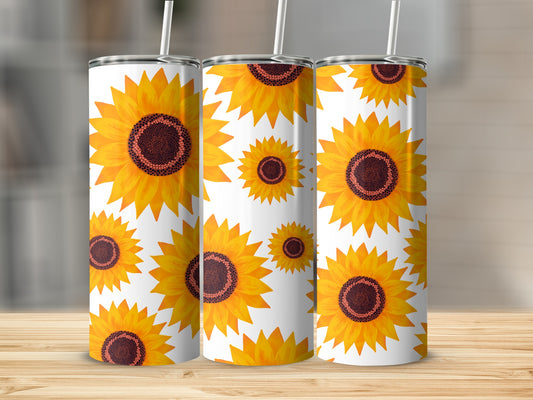 Three tumblers with a repeating sunflower pattern on a wooden surface.