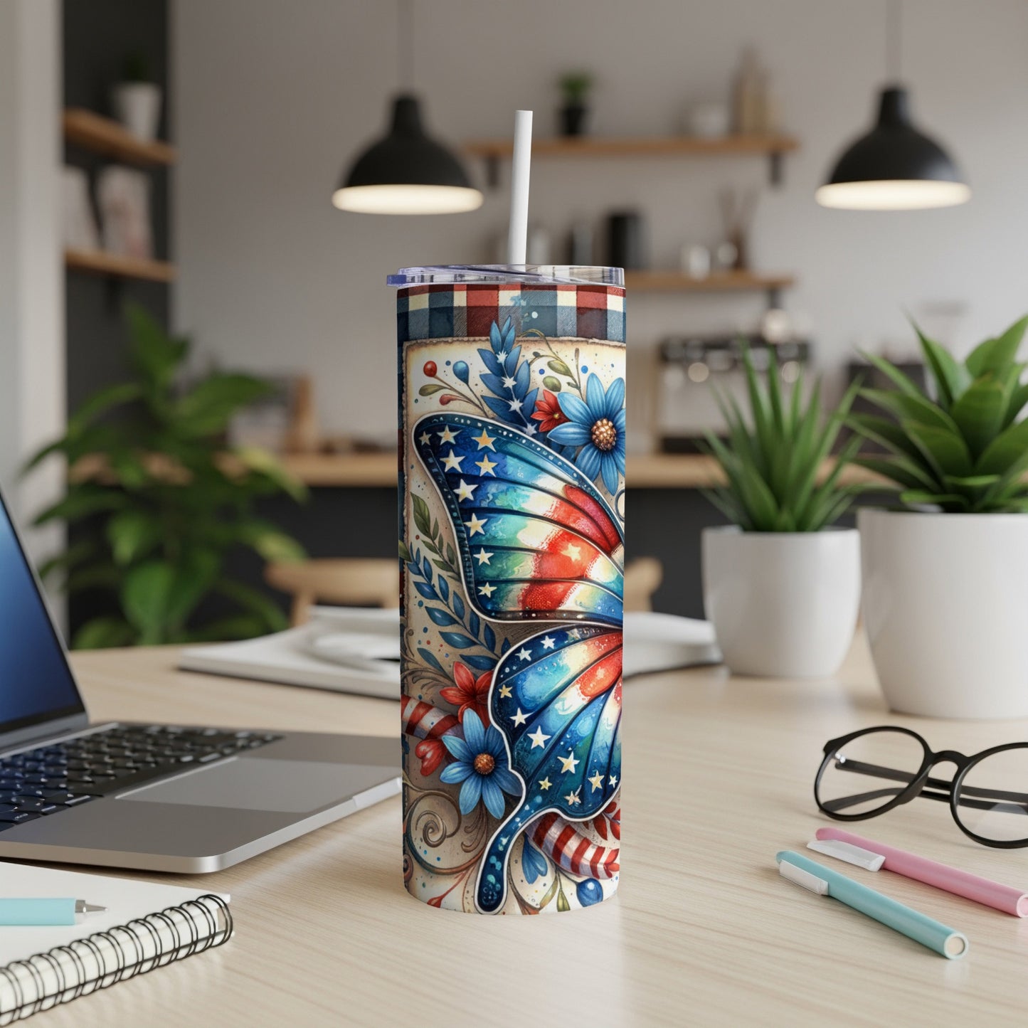 Tumbler with patriotic butterfly and floral design, plaid lid.