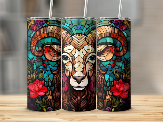 Stained glass tumbler with Aries ram design and floral accents.