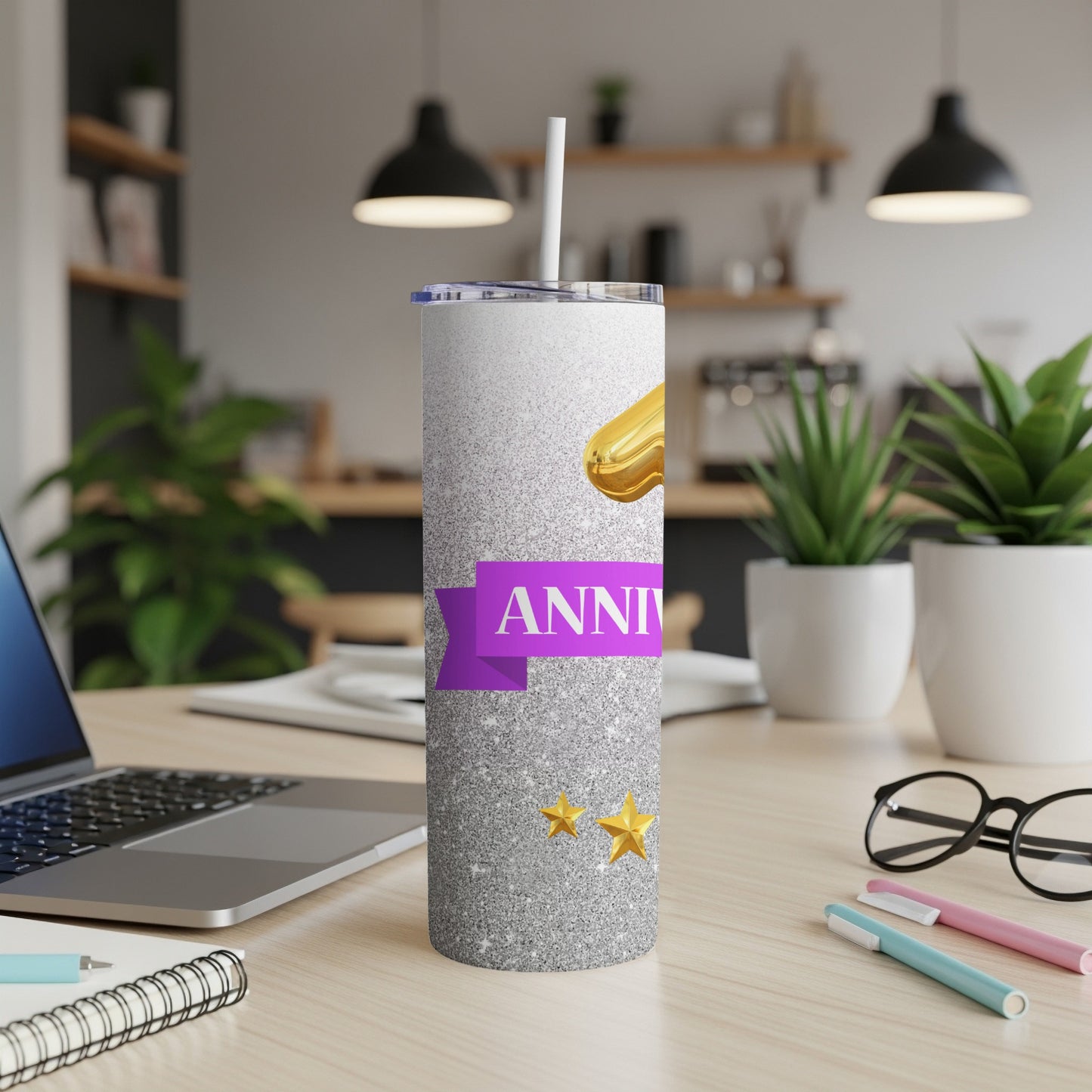 Silver tumbler with "Anniversary" text, stars, and golden ribbon detail.