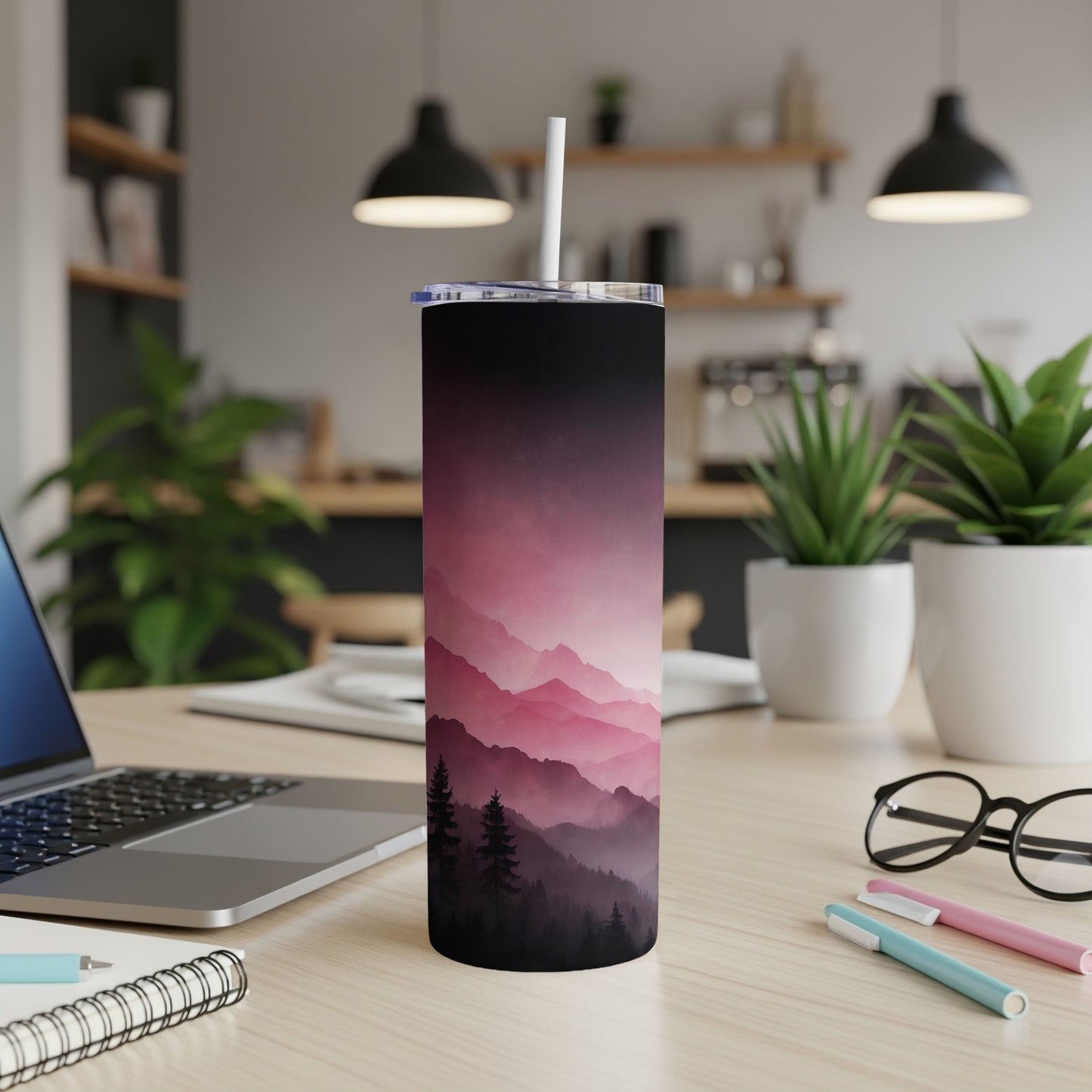 Tall tumbler with pink and purple mountain landscape design.