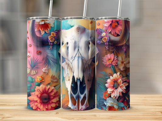 Three tumblers with a cow skull and floral designs.