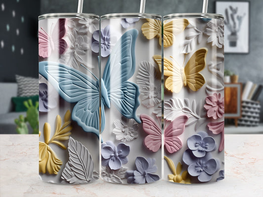 Three tumblers with embossed butterfly and floral designs in pastel colors.