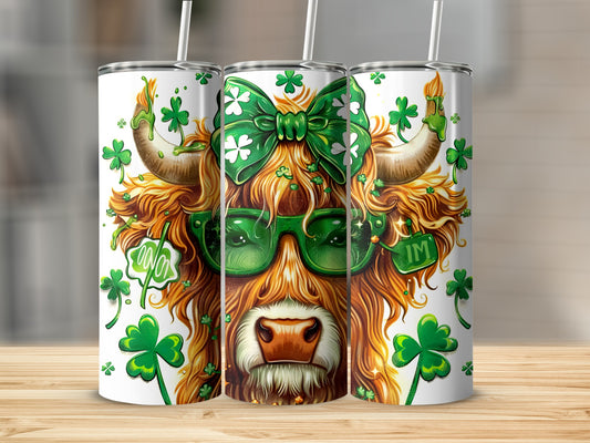 Highland cow with green sunglasses and bow on St. Patrick's Day.