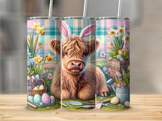 Highland cow with Easter bunny ears surrounded by Easter eggs and spring flowers.