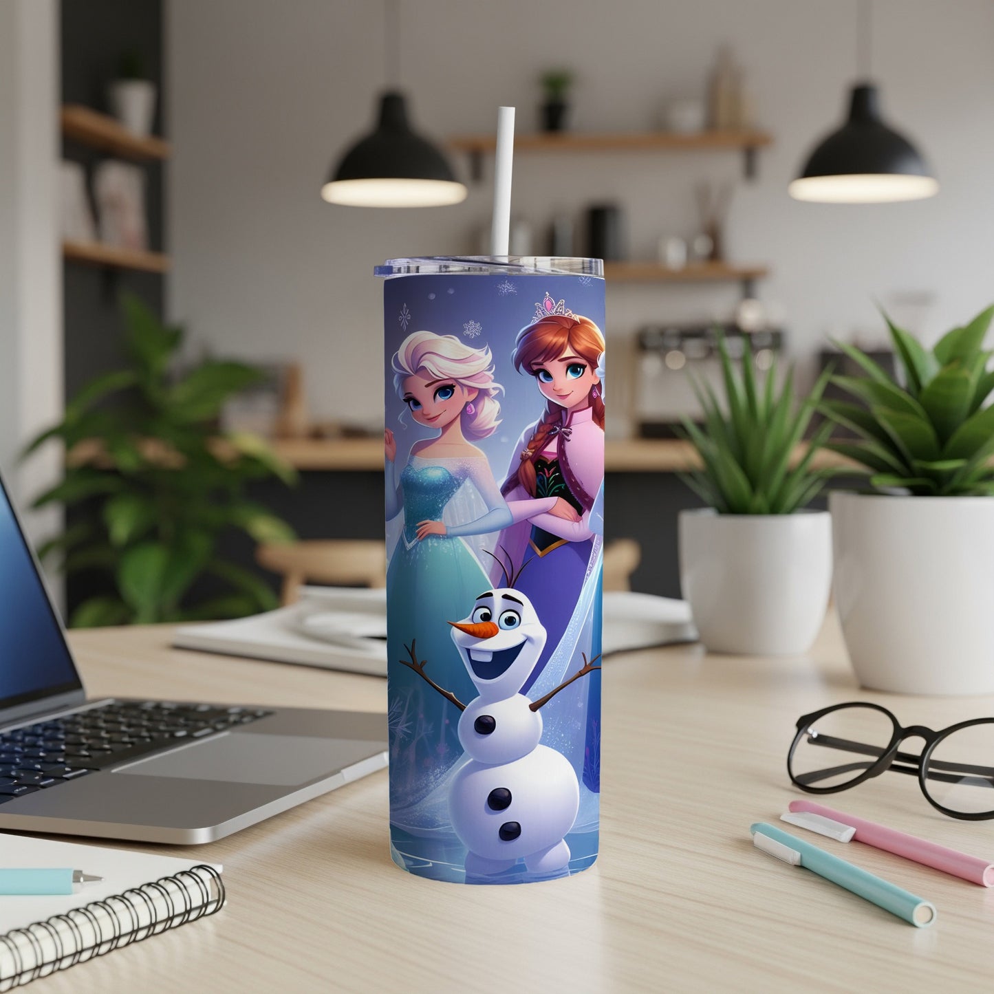 Elsa, Anna, and Olaf from Frozen on a white tumbler with a straw.