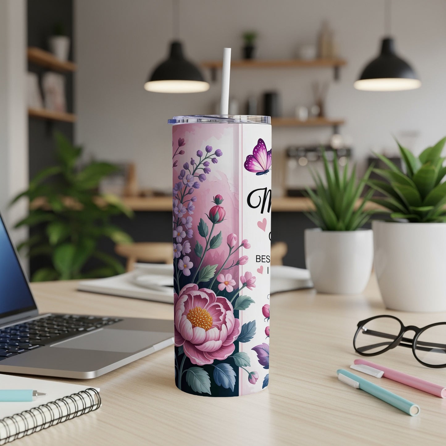 Pink floral tumbler with "Best Mom Ever" text and butterfly.