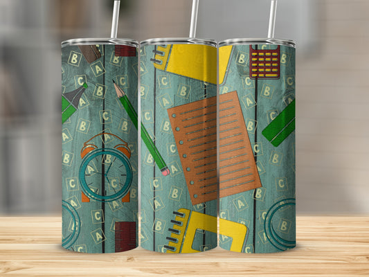 Three tumblers with a repeating pattern of school supplies and alphabet letters.