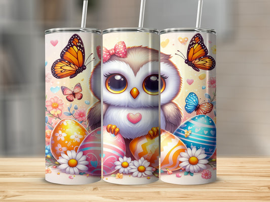 Cute owl with butterflies and Easter eggs on a wooden surface.
