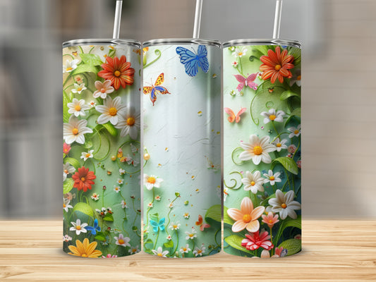 Three tall tumblers with a floral and butterfly design.