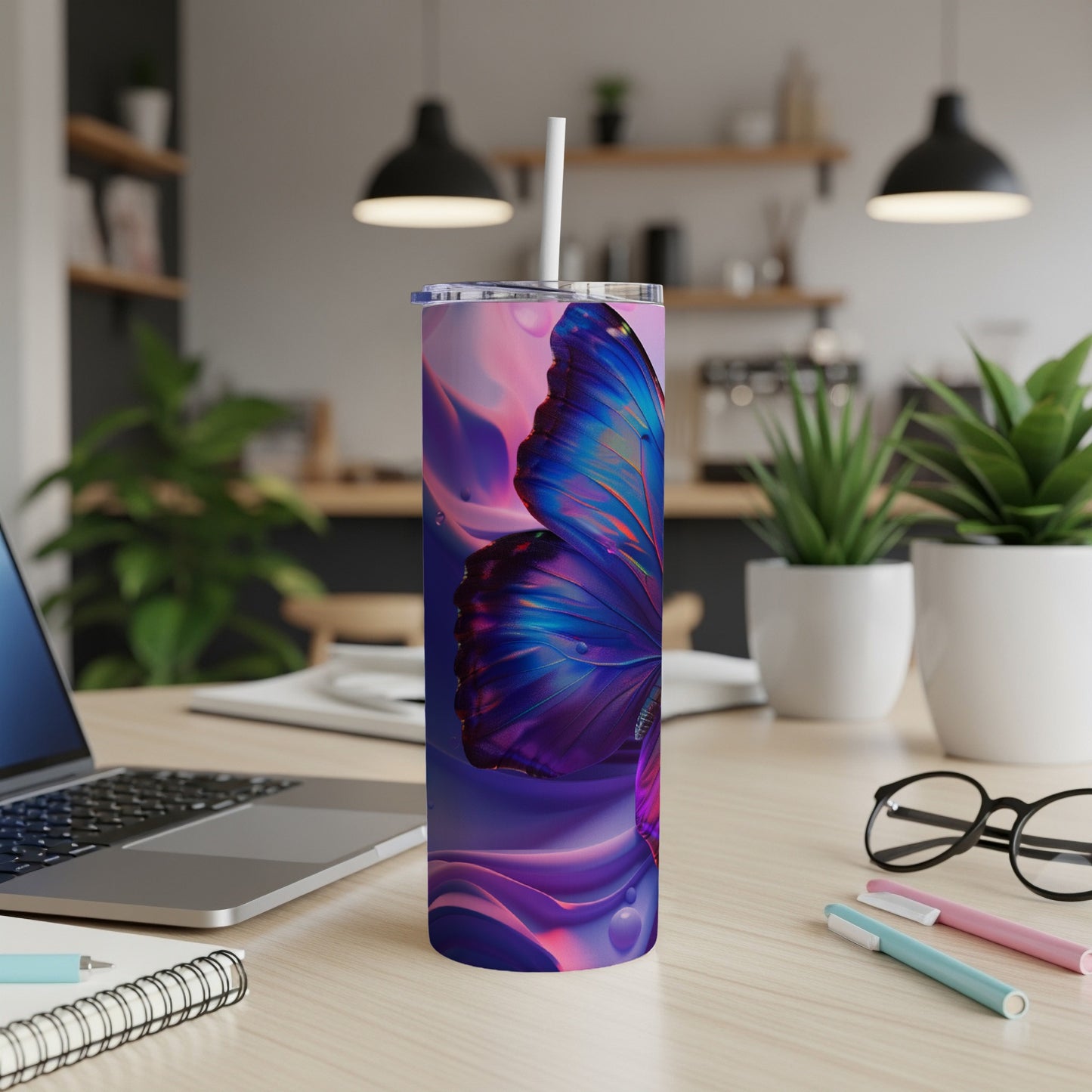 Purple and blue butterfly on a tall tumbler with a straw.