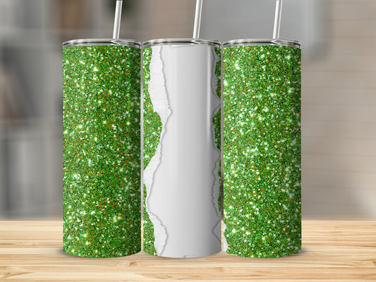 Three green glitter tumblers with torn paper effect on a wooden surface.