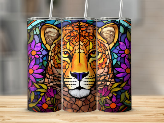 Leopard face mosaic art on a set of three tall, cylindrical tumblers.