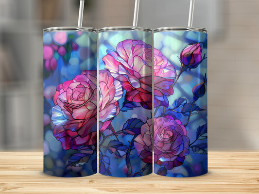 Three tumblers featuring a stained glass rose design on a wooden surface.