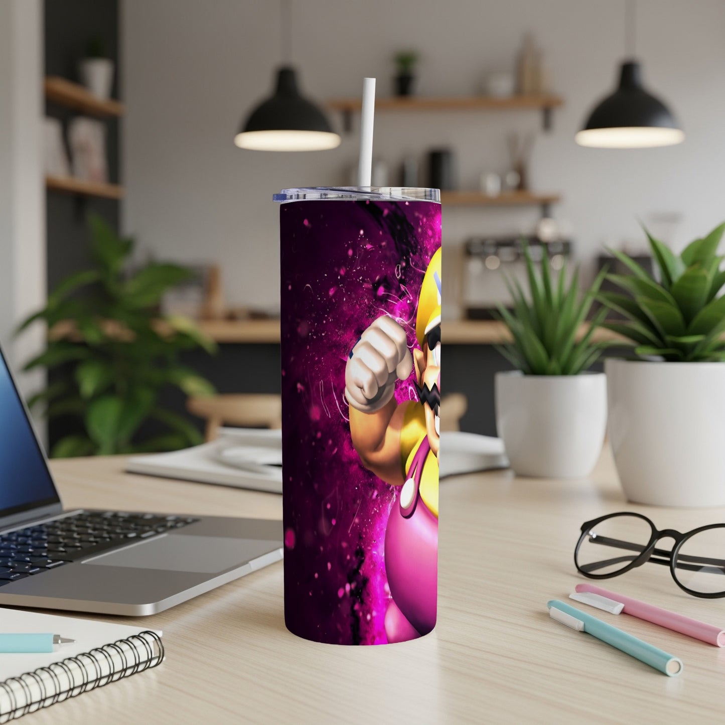 Wario character art on a purple and pink gradient tumbler with a straw.