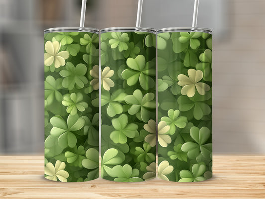 Three tumblers with a seamless pattern of green and light green clover leaves.