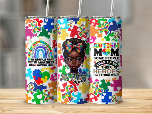 Three tumblers with autism awareness puzzle pieces and motivational text.