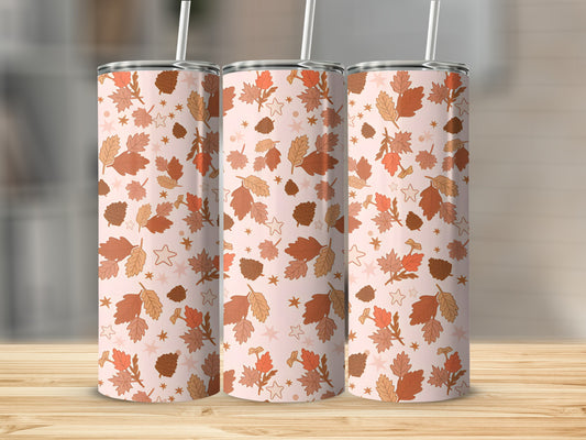 Three tall tumblers with a repeating pattern of autumn leaves and stars.