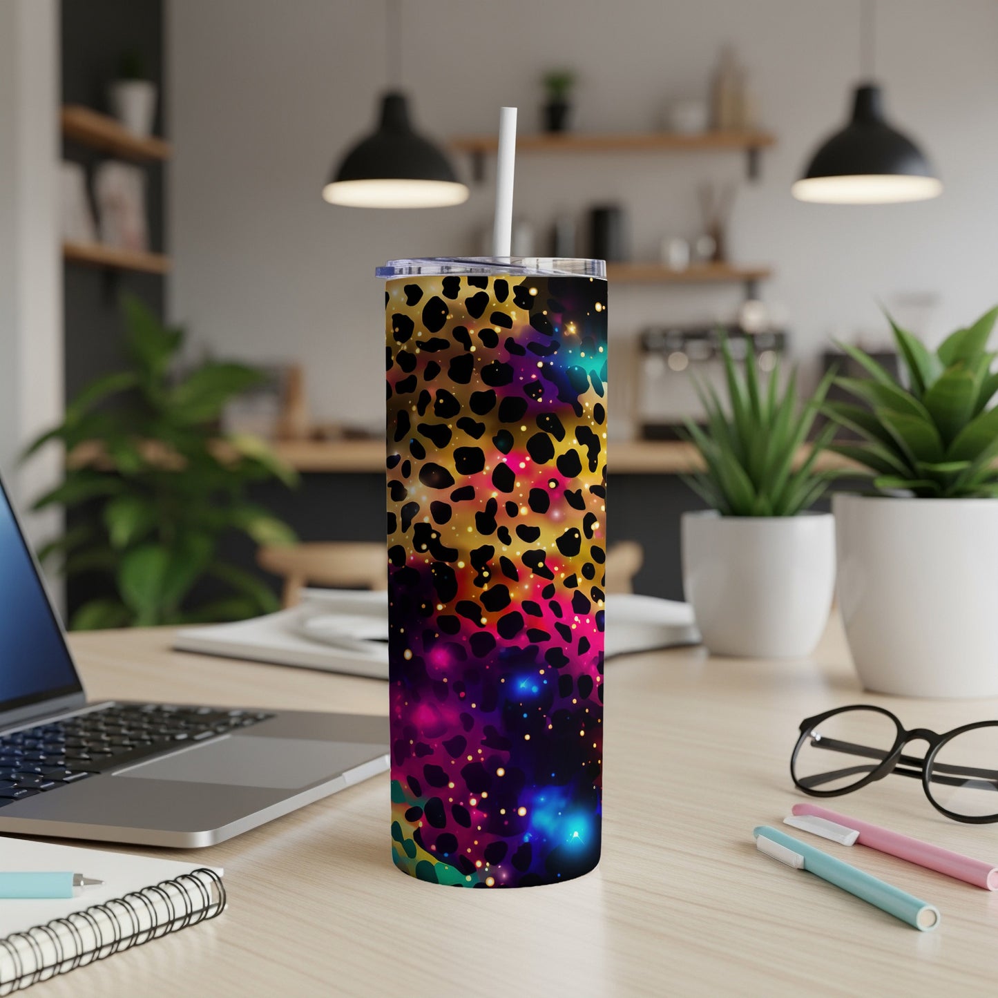 Leopard print tumbler with cosmic starry background and straw.