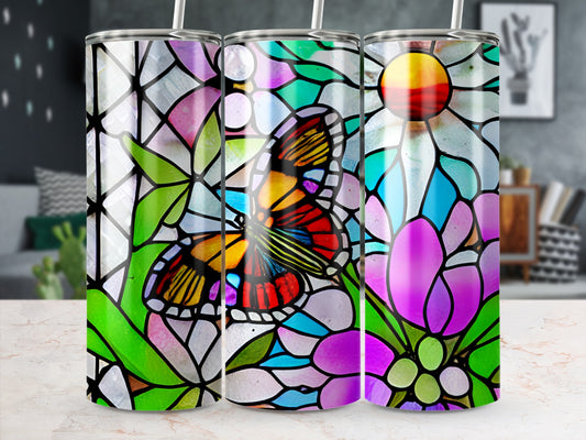Stained glass tumbler with butterfly and floral designs.