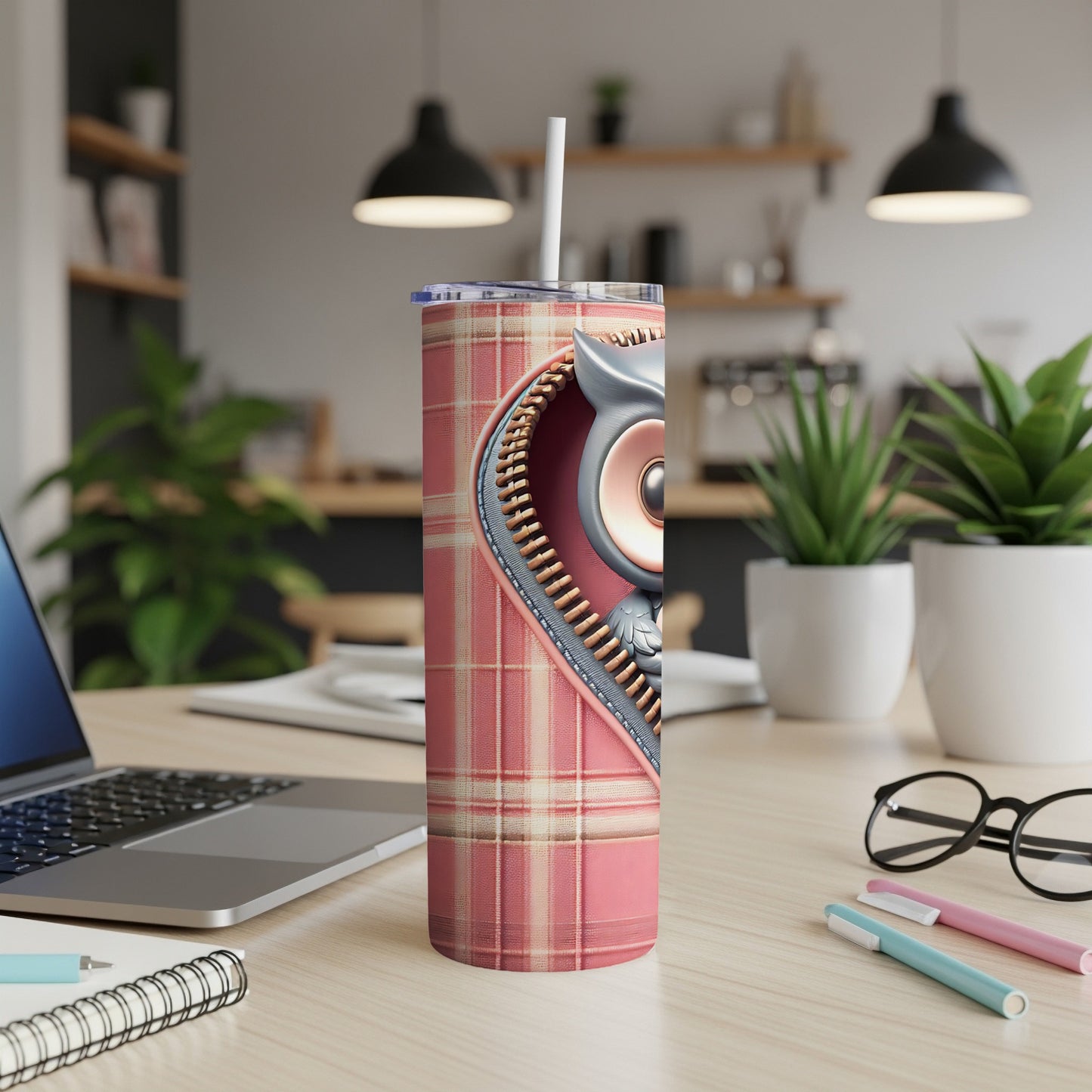 Pink plaid tumbler with zipper revealing cartoon owl.