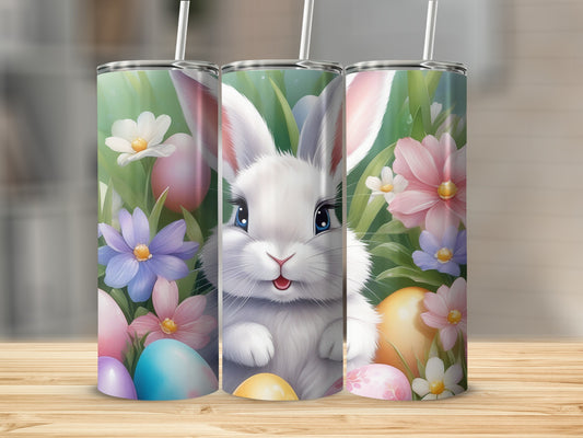 Three Easter bunny tumblers with flowers and painted eggs.