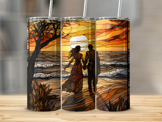 Two people silhouetted against a stained-glass sunset on a beach.