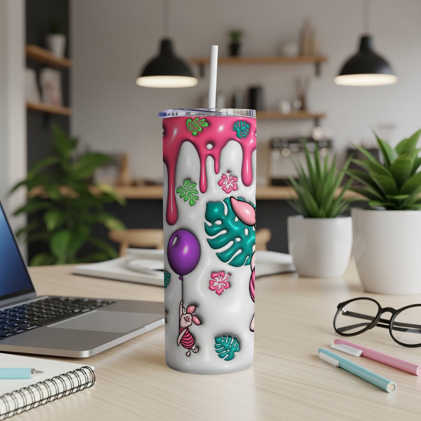 Winnie the Pooh tumbler with pink, green, and purple graphic designs.