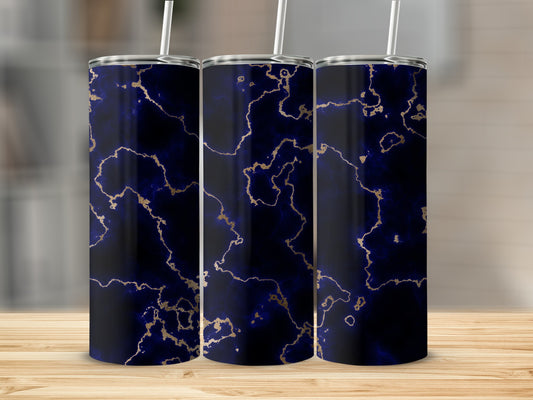 Three dark blue tumblers with gold marble patterns and white straws.