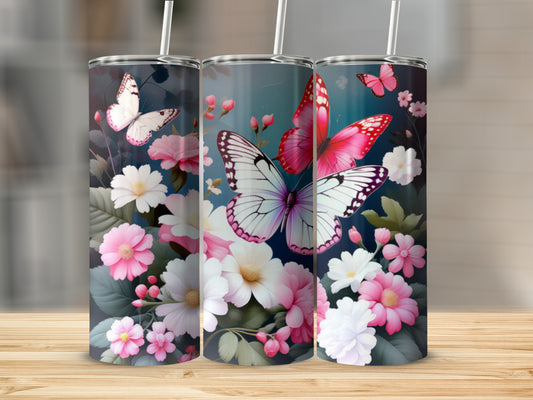 Floral tumblers with butterflies and pink flowers on a dark background.