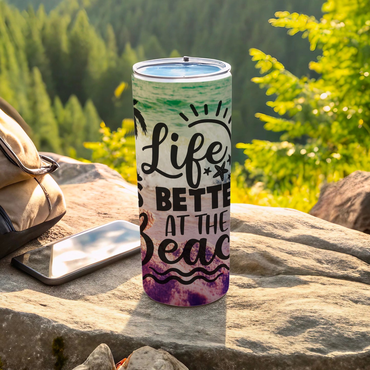 Tumbler with "Life is better at the beach" text and palm trees.
