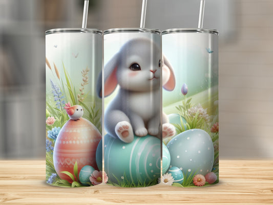Easter bunny and eggs tumbler with springtime background.