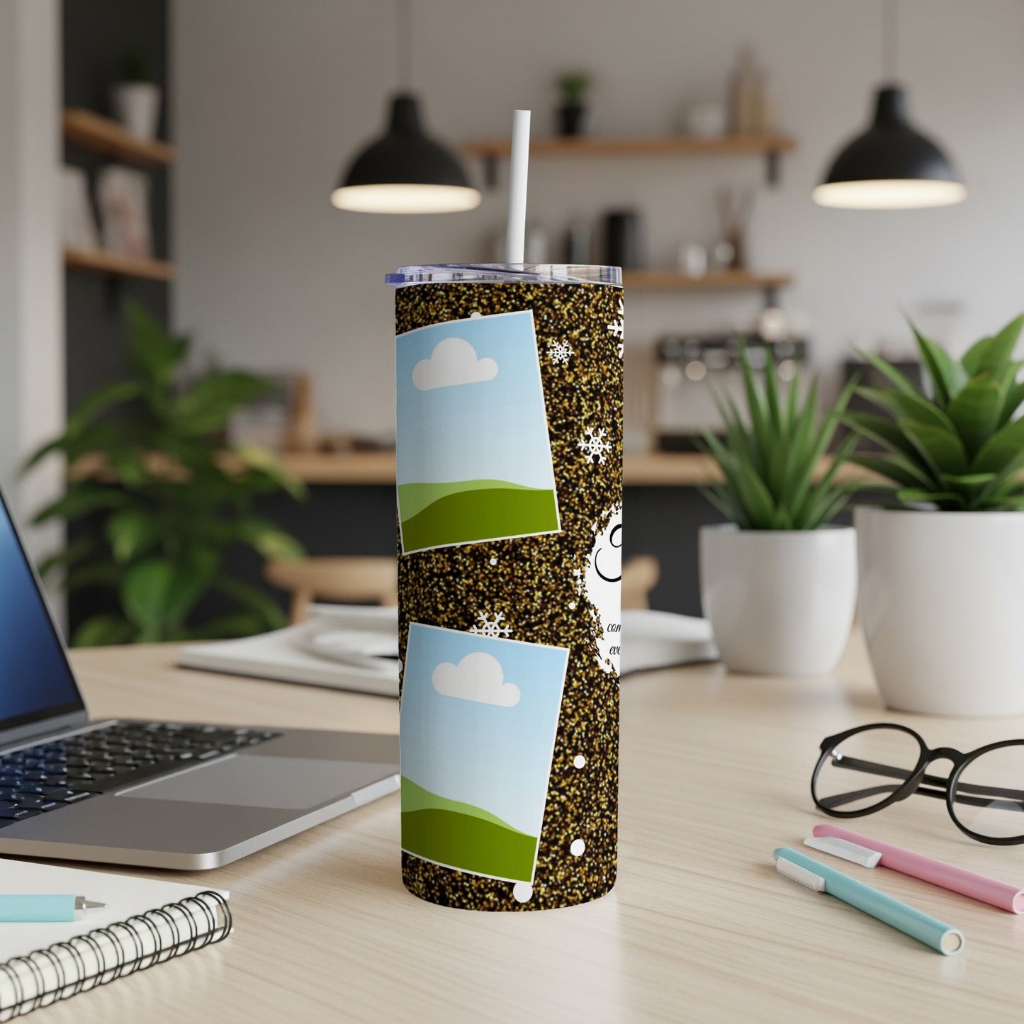 Tumbler with glitter, snowflakes, and two photo frames, one above the other.