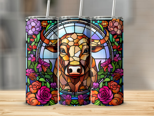 Stained glass bull with floral border on a tumbler.