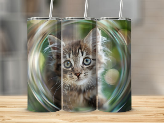 Three tumblers featuring a kitten's face with green bokeh background.