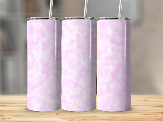 Three pink marbled tumblers with white straws on a wooden surface.