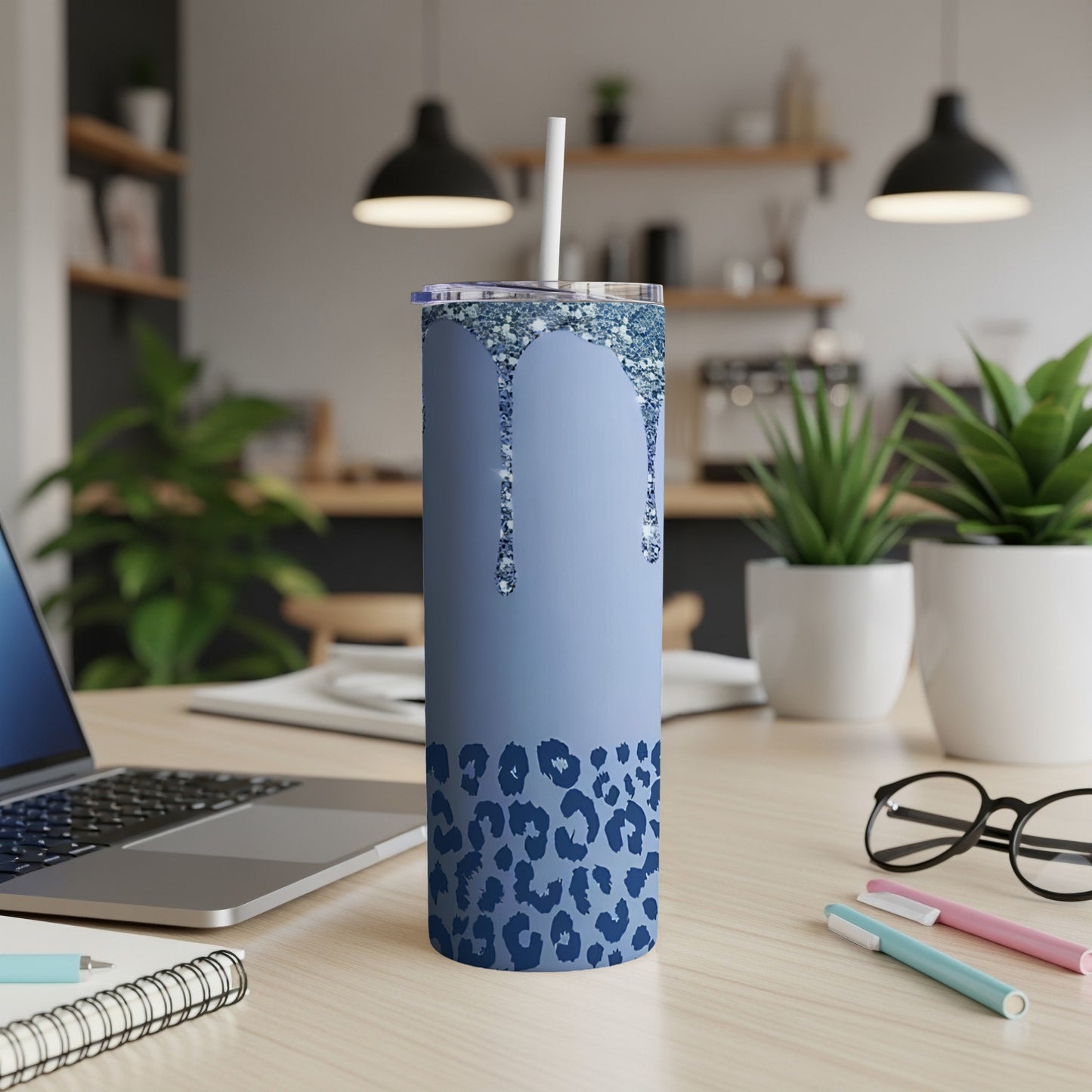 Blue glitter drip tumbler with navy leopard print.