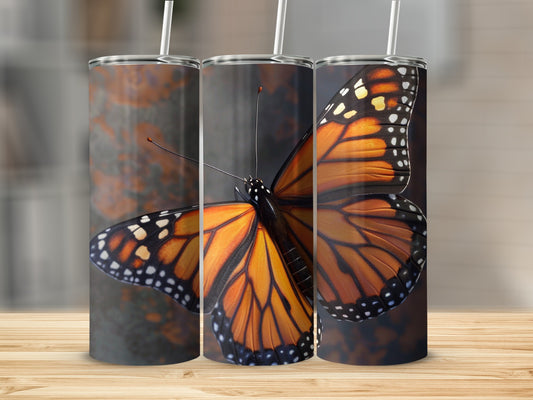 Monarch butterfly on a tumbler with a rustic background.