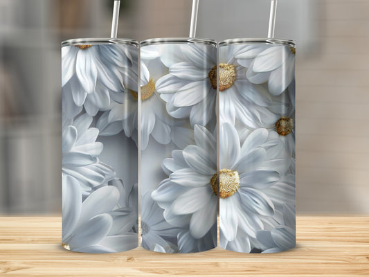Three white floral tumblers with gold centers on a wooden surface.
